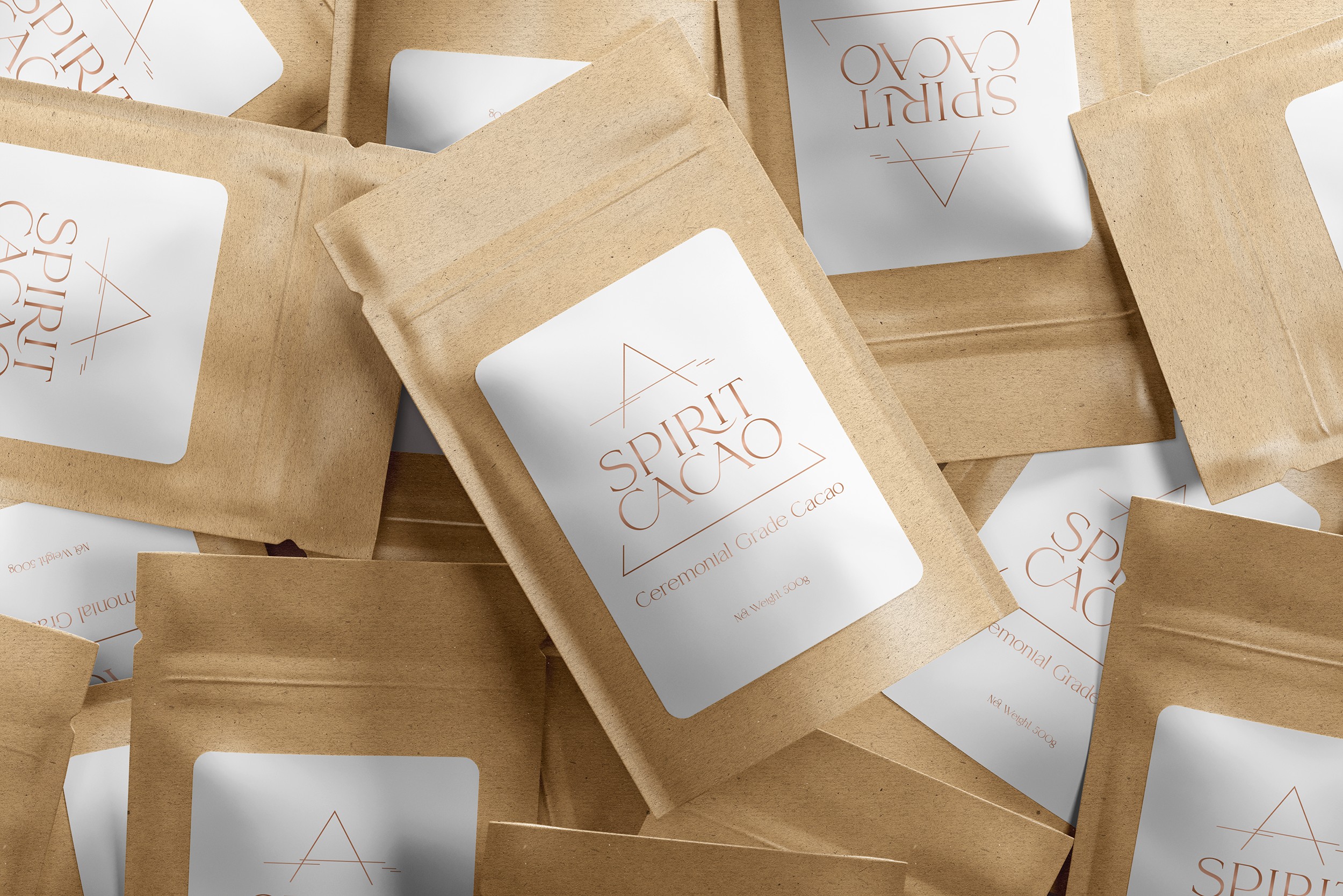 A picture of a pile 500g bags of cacao powder. Brown bag with a white label